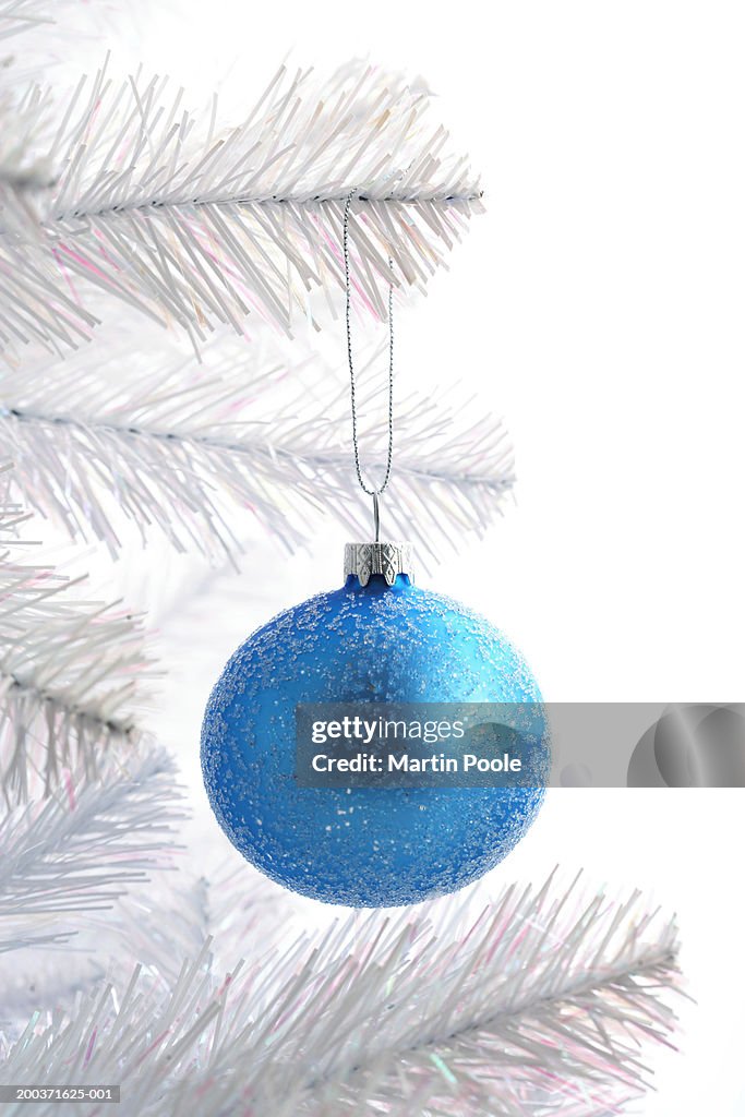 Blue bauble decoration on Christmas tree, close up