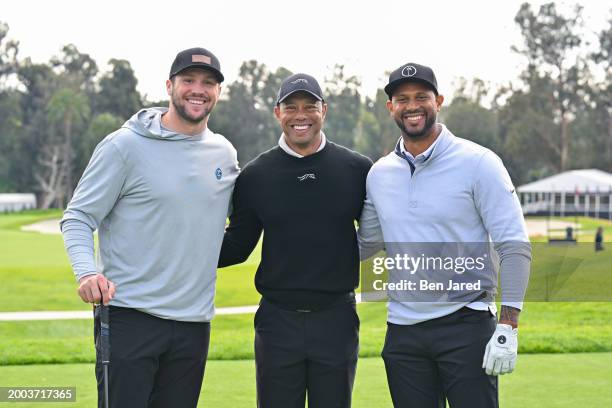 Tiger Woods, Buffalo Bills quarterback, Josh Allen, and Los Angeles Angels player, Aaron Hicks, pose for a photo together on the 10th tee box prior...