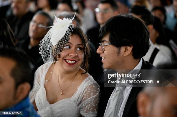 Couple takes part in a collective wedding celebration at the esplanade of the Municipal Palace of Nezahualcoyotl in Nezahualcoyotl, Mexico on...