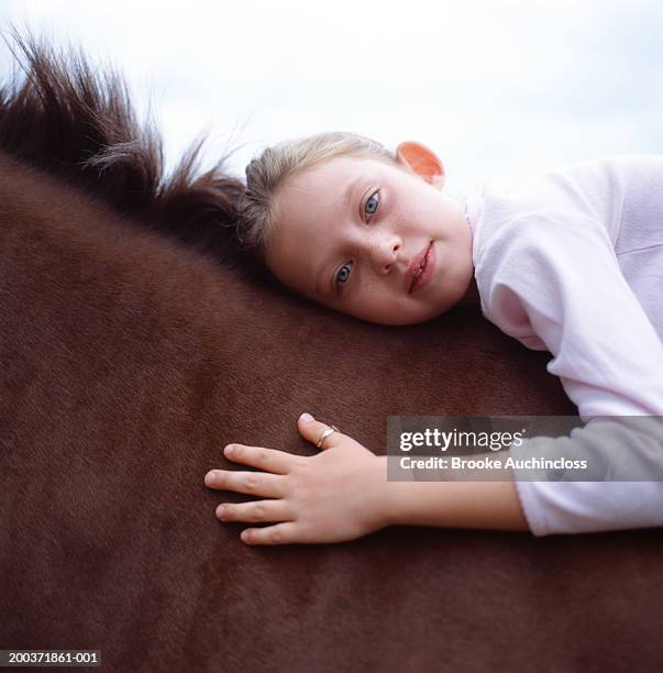 young girl on horse, portrait - child horse stock pictures, royalty-free photos & images