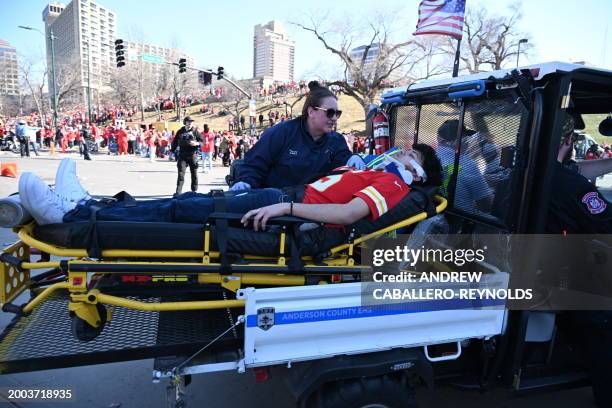 Victim is aided after shots were fired near the Kansas City Chiefs' Super Bowl LVIII victory parade on February 14 in Kansas City, Missouri.