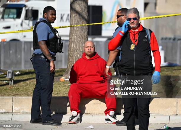 Person is detained by police near the Kansas City Chiefs' Super Bowl LVIII victory parade on February 14 in Kansas City, Missouri. Shots were...