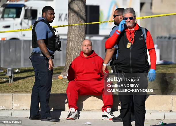 Person is detained by police near the Kansas City Chiefs' Super Bowl LVIII victory parade on February 14 in Kansas City, Missouri. Shots were...