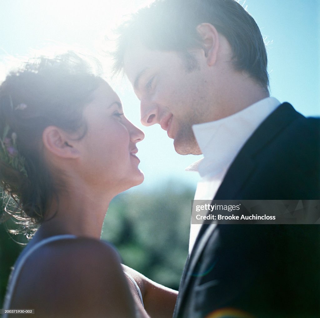 Bride and groom looking at each other