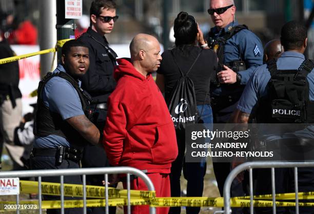 Person is detained by police near the Kansas City Chiefs' Super Bowl LVIII victory parade on February 14 in Kansas City, Missouri. Shots were...