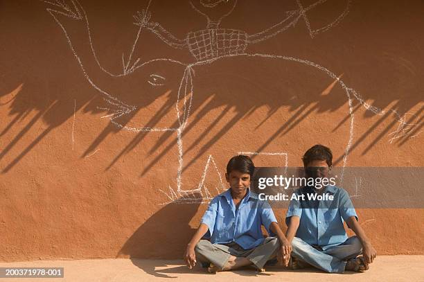 india, rajasthan, pushkar, two boys next to drawing on wall, portrait - art wolfe stock pictures, royalty-free photos & images