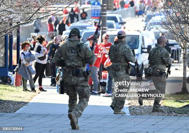 Police respond to an active shooter after shots were fired near the Kansas City Chiefs' Super Bowl LVIII victory parade on February 14 in Kansas...