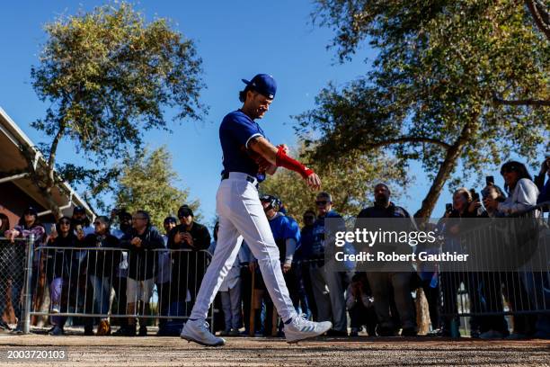 Goodyear, Arizona, Wednesday, February 14, 2024 - Dodgers pitcher Joe Kelly walks past fans to begin the official first day of spring training.