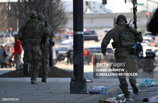 Police respond to an active shooter after shots were fired near the Kansas City Chiefs' Super Bowl LVIII victory parade on February 14 in Kansas...