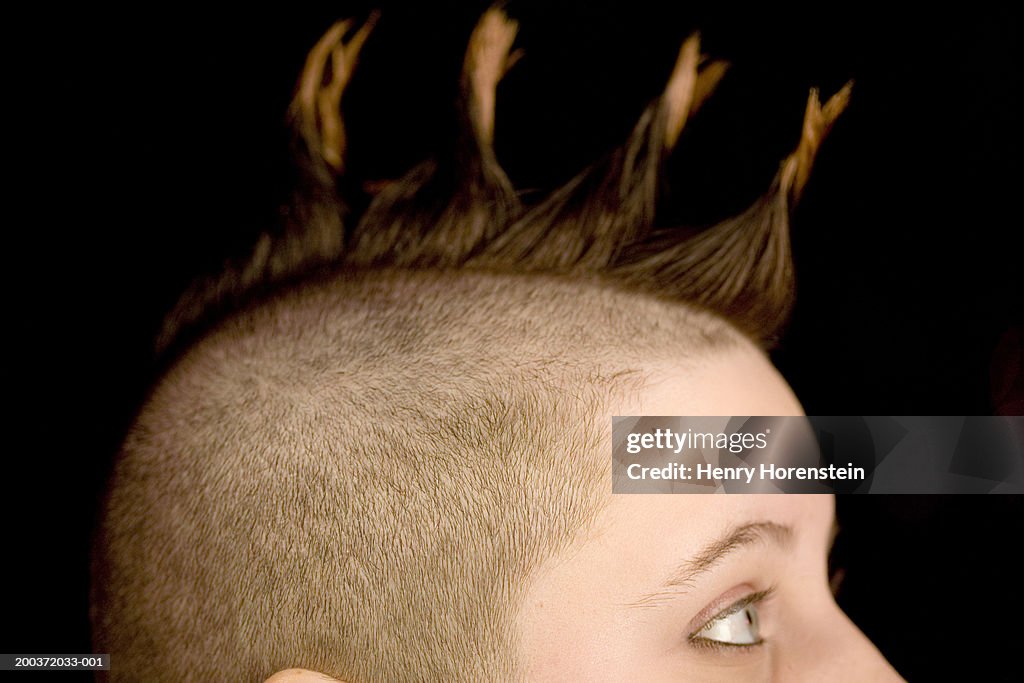 Woman's with mohawk hairdo, side view, close-up