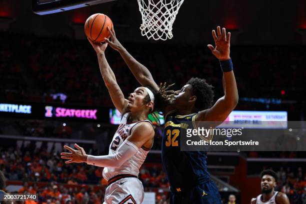 Michigan forward Tarris Reed Jr. Blocks the shot of Illinois guard Dra Gibbs-Lawhorn during a college basketball game between the Michigan Wolverines...