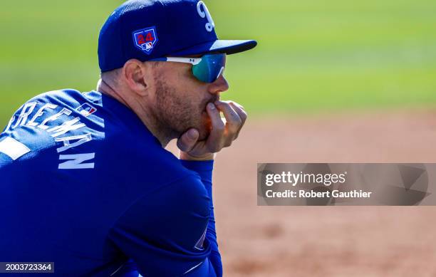 Goodyear, Arizona, Wednesday, February 14, 2024 - Dodgers first baseman Freddie Freeman, looks on from the sideline during a spring training workout.