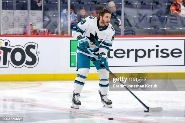 Mike Hoffman of the San Jose Sharks takes part in the pre-game warm up prior to NHL action against the Winnipeg Jets at the Canada Life Centre on...