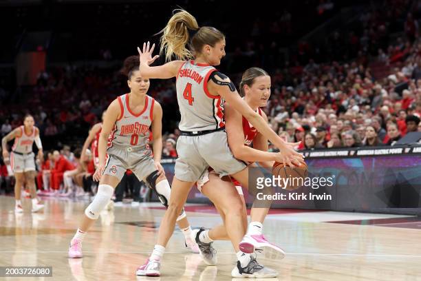 Jacy Sheldon of the Ohio State Buckeyes attempts to steal the ball from Callin Hake of the Nebraska Cornhuskers during the fist quarter of the game...