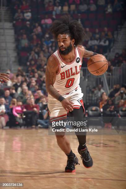 Coby White of the Chicago Bulls handles the ball during the game against the Cleveland Cavaliers on February 14, 2024 at Rocket Mortgage FieldHouse...