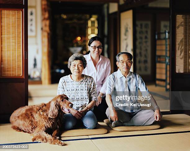 senior couple and mature woman siting in temple with dog, portrait - japan photos stock pictures, royalty-free photos & images
