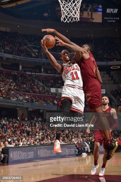 DeMar DeRozan of the Chicago Bulls drives to the basket against Evan Mobley of the Cleveland Cavaliers during the game on February 14, 2024 at Rocket...