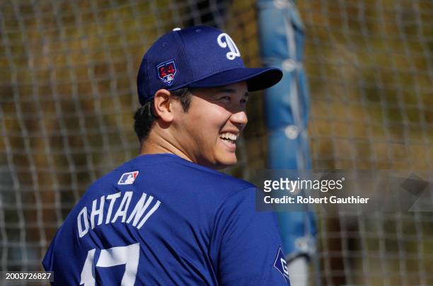 Goodyear, Arizona, Wednesday, February 14, 2024 - Shohei Ohtani warms up near the batting cage before taking some swings during Dodgers spring...