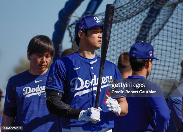 Goodyear, Arizona, Wednesday, February 14, 2024 - Shohei Ohtani warms up near the batting cage before taking some swings during Dodgers spring...