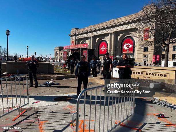 Kansas City police are seen at Union Station, where a shooting broke out during the Chiefs' Super Bowl victory rally on Wednesday, Feb. 14 in Kansas...
