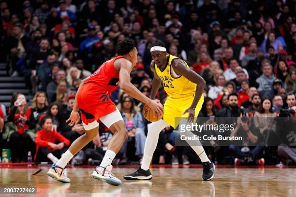 Pascal Siakam of the Indiana Pacers plays defence on Scottie Barnes of the Toronto Raptors during the first half of their NBA game at Scotiabank...