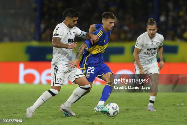 Enzo Kalinski of Central Cordoba fights for the ball with Kevin Zenon of Boca Juniors during a Copa de la Liga 2024 group B match between Boca...