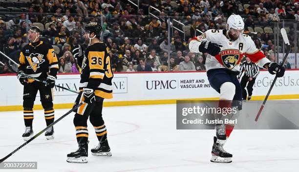 Aaron Ekblad of the Florida Panthers reacts after scoring a goal in the second period during the game against the Pittsburgh Penguins at PPG PAINTS...