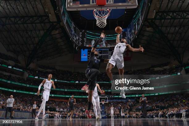 Blake Wesley of the San Antonio Spurs dunks the ball during the game against the Dallas Mavericks on February 14, 2024 at the American Airlines...