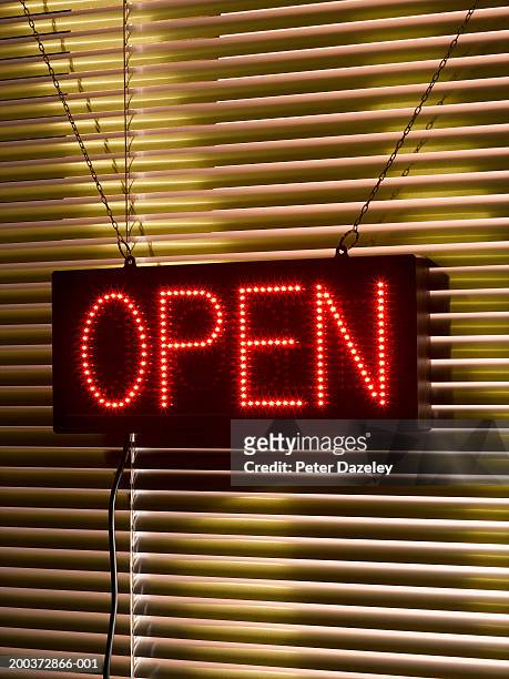 illuminated 'open' sign - open sign stock pictures, royalty-free photos & images