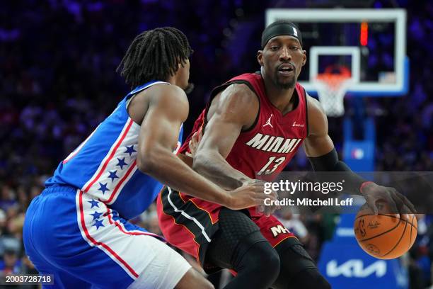 Bam Adebayo of the Miami Heat dribbles the ball against Tyrese Maxey of the Philadelphia 76ers in the second half at the Wells Fargo Center on...