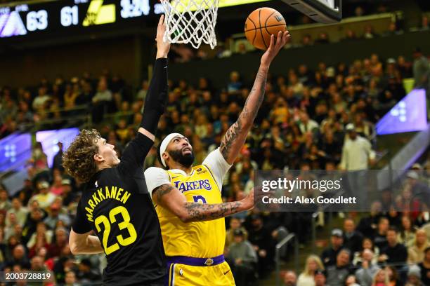 Anthony Davis of the Los Angeles Lakers shoots over Lauri Markkanen of the Utah Jazz during the first half of a game at Delta Center on February 14,...