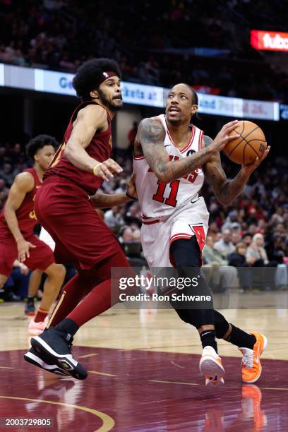 DeMar DeRozan of the Chicago Bulls drives the lane against Jarrett Allen of the Cleveland Cavaliers during the second half at Rocket Mortgage...