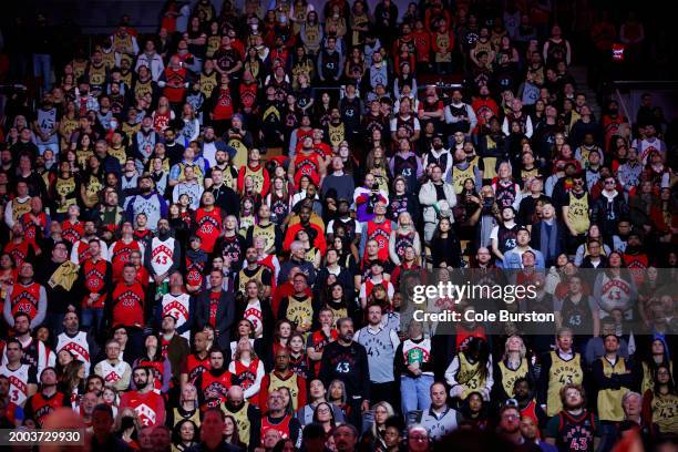 Fans wear Pascal Siakam's Toronto jersey as Pascal Siakam of the Indiana Pacers is honored upon his first game back in Toronto after being traded...