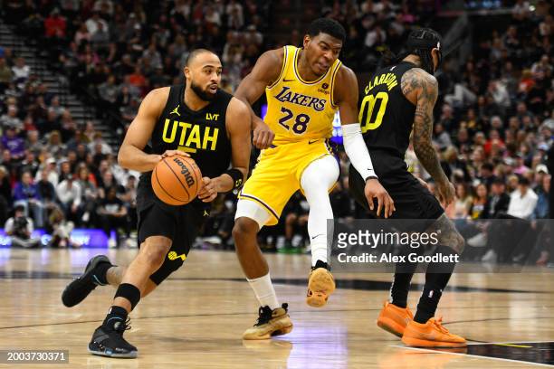 Talen Horton-Tucker of the Utah Jazz drives into Rui Hachimura of the Los Angeles Lakers during the second half of a game at Delta Center on February...