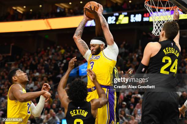 Anthony Davis of the Los Angeles Lakers rebounds over Collin Sexton of the Utah Jazz during the second half of a game at Delta Center on February 14,...