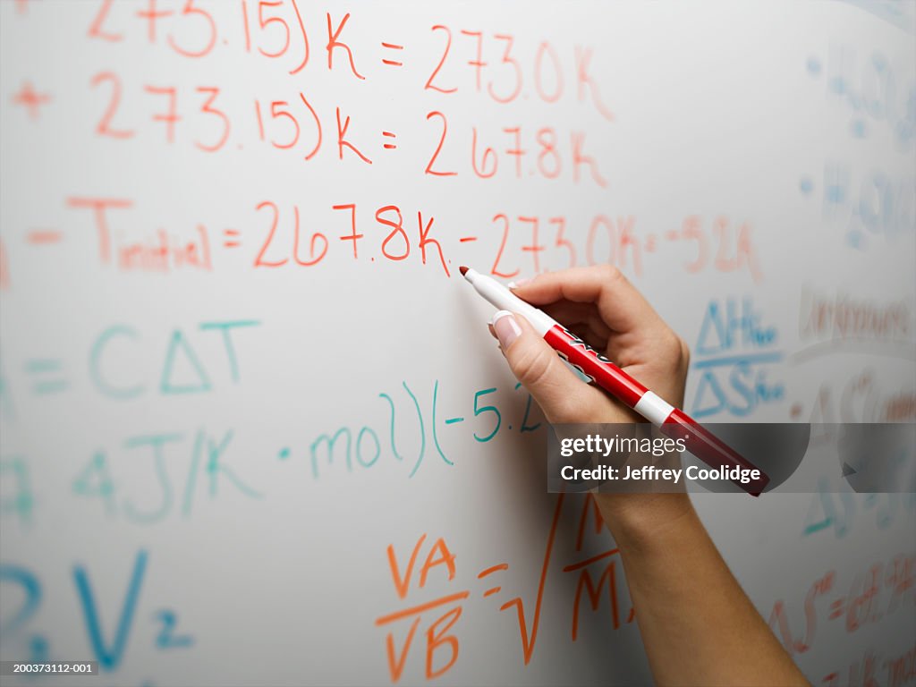 Person Writing Math Woman Writing Mathematical Equations On Whiteboard Closeup High-Res ...