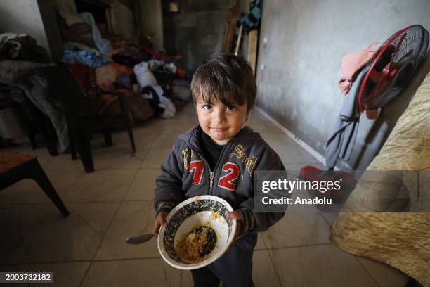 Palestinian Abu Nidal Abdelkader, who was forced to flee his home due to the attacks of Israeli forces, continues to live with his family in his...