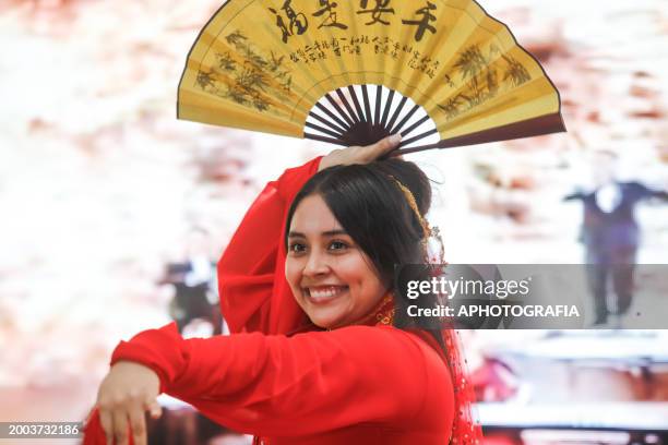 Dancer performs during a Chinese New Year celebration at El Salvador National Library on February 14, 2024 in San Salvador, El Salvador.