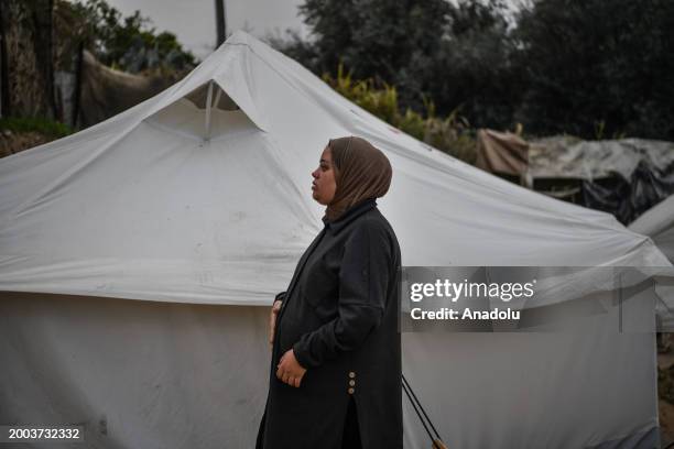 Year-old Rua al-Sindavi, a Palestinian pregnant with triplets expects to give birth in a tent due to insufficient medical facilities, and had to...