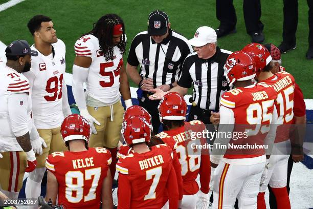 Captains for the Kansas City Chiefs and San Francisco 49ers lineup for the coin toss prior to Super Bowl LVIII at Allegiant Stadium on February 11,...