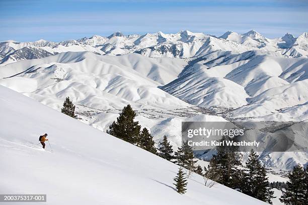 usa, idaho, sun valley, man downhill skiing, side view - mountain side stock pictures, royalty-free photos & images