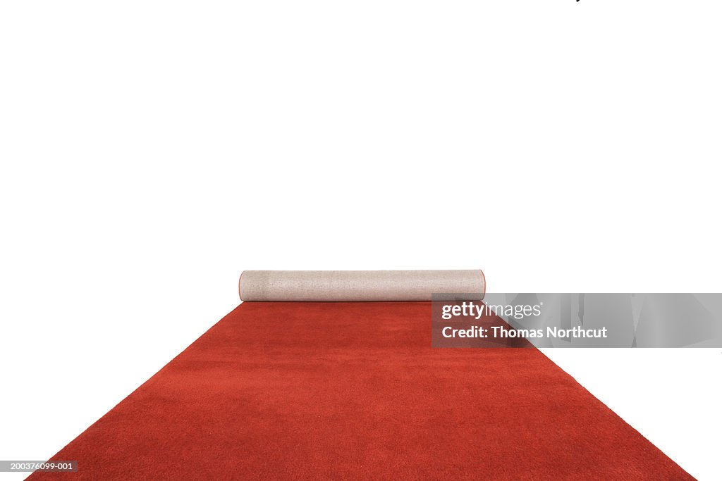 Partially unrolled red carpet