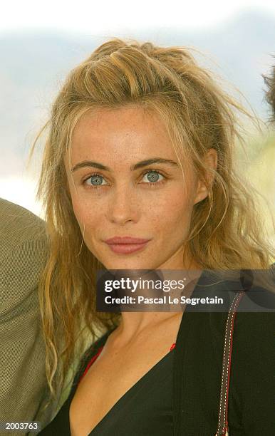 Actress Emmanuelle Beart poses for the cameras during a photocall for the film "Les Egares" at the Palais des Festivals during the 56th International...