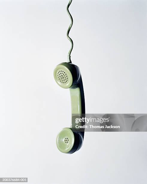 retro green telephone receiver with cord extended - landline phone foto e immagini stock