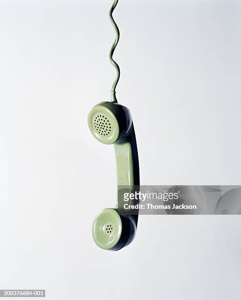 retro green telephone receiver with cord extended - telefonlur bildbanksfoton och bilder