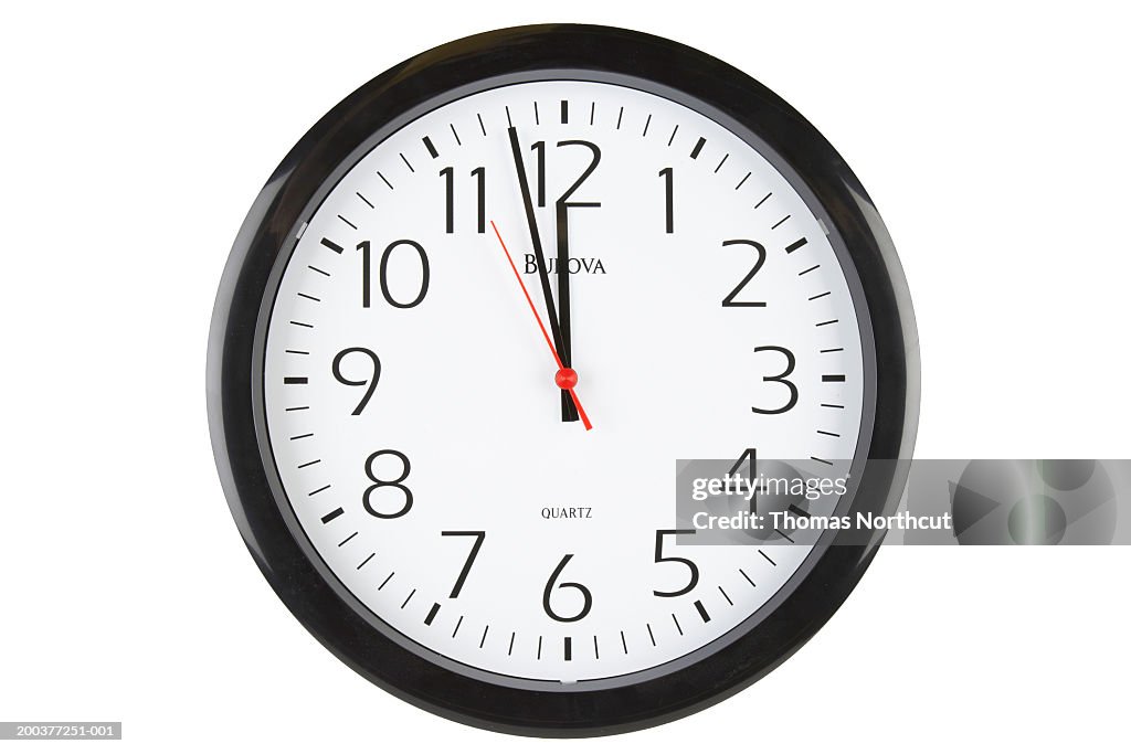Clock showing two minutes before 12 o'clock