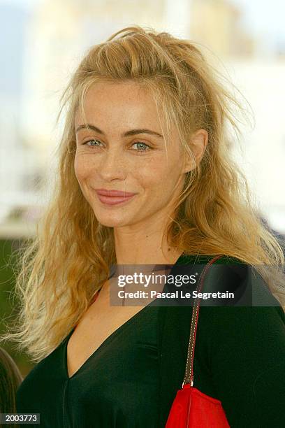 Actress Emmanuelle Beart poses for the cameras during a photocall for the film "Les Egares" at the Palais des Festivals during the 56th International...