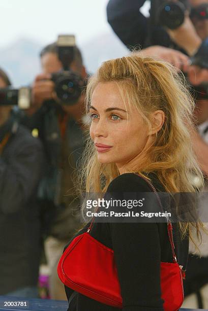 Actress Emmanuelle Beart poses for the cameras during a photocall for the film "Les Egares" at the Palais des Festivals during the 56th International...