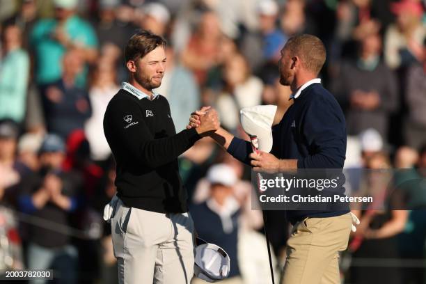 Sam Burns of the United States and Daniel Berger of the United States shake hands on the 18th green during the final round of the WM Phoenix Open at...