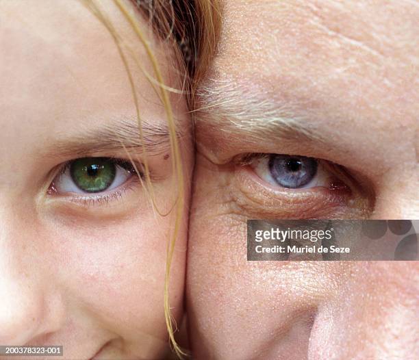father and daughter (6-8) cheek to cheek, portrait, close-up - two kids looking at each other stockfoto's en -beelden